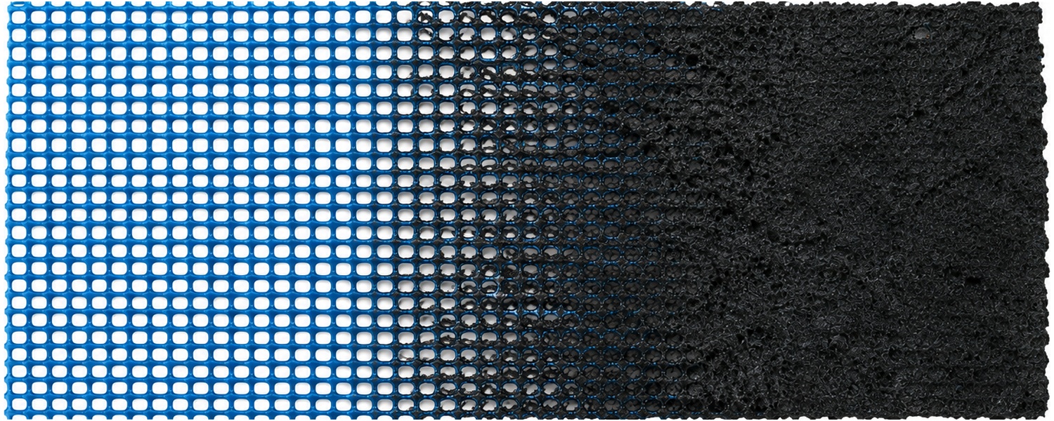 Close-up of INCA WFS net® showing the transition from the original blue mesh to the expanded black char layer after heat exposure