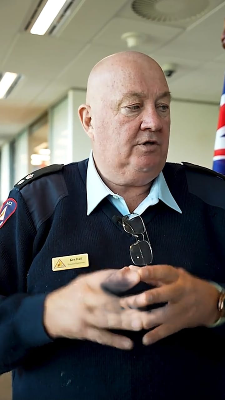 Senior fire service officer in a navy uniform speaking indoors
